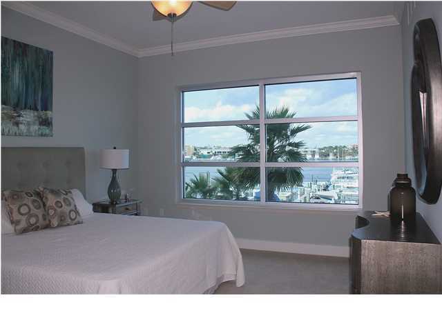 211 Durango Road, Unit 213 Destin, FL 32541 - Photo 13 of 32 a living room with a large window and a flat screen tv