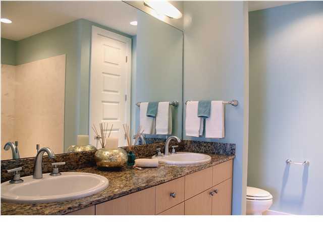 211 Durango Road, Unit 213 Destin, FL 32541 - Photo 15 of 32 a bathroom with a granite countertop double vanity sink a mirror and a toilet