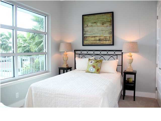 211 Durango Road, Unit 213 Destin, FL 32541 - Photo 17 of 32 a bedroom with a bed and a window