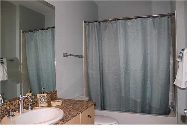 211 Durango Road, Unit 213 Destin, FL 32541 - Photo 20 of 32 a bathroom with a sink and a mirror