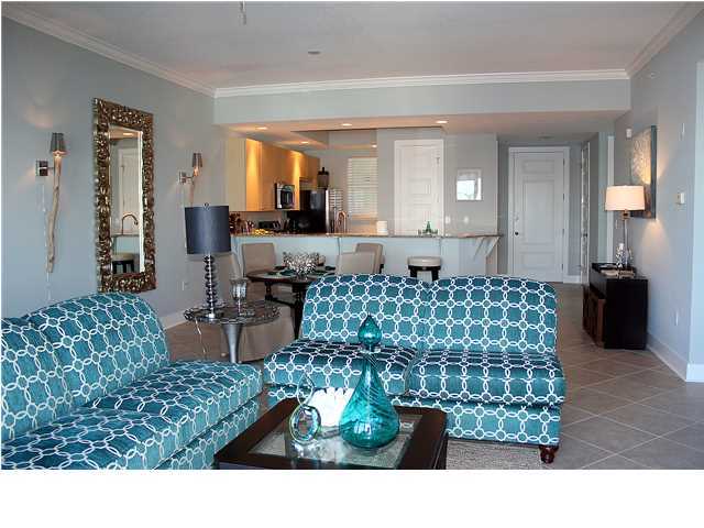 211 Durango Road, Unit 213 Destin, FL 32541 - Photo 7 of 32 a living room with a couch and a table