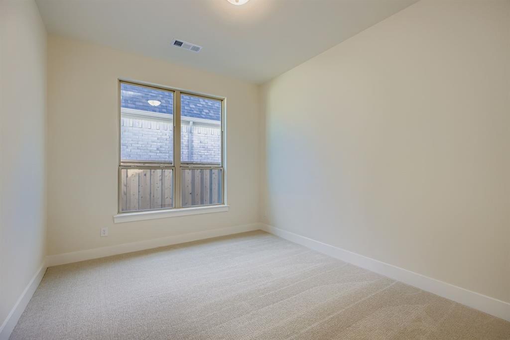 4813 Strada Street Prosper, TX 75078 - Photo 17 of 28 an empty room with a window