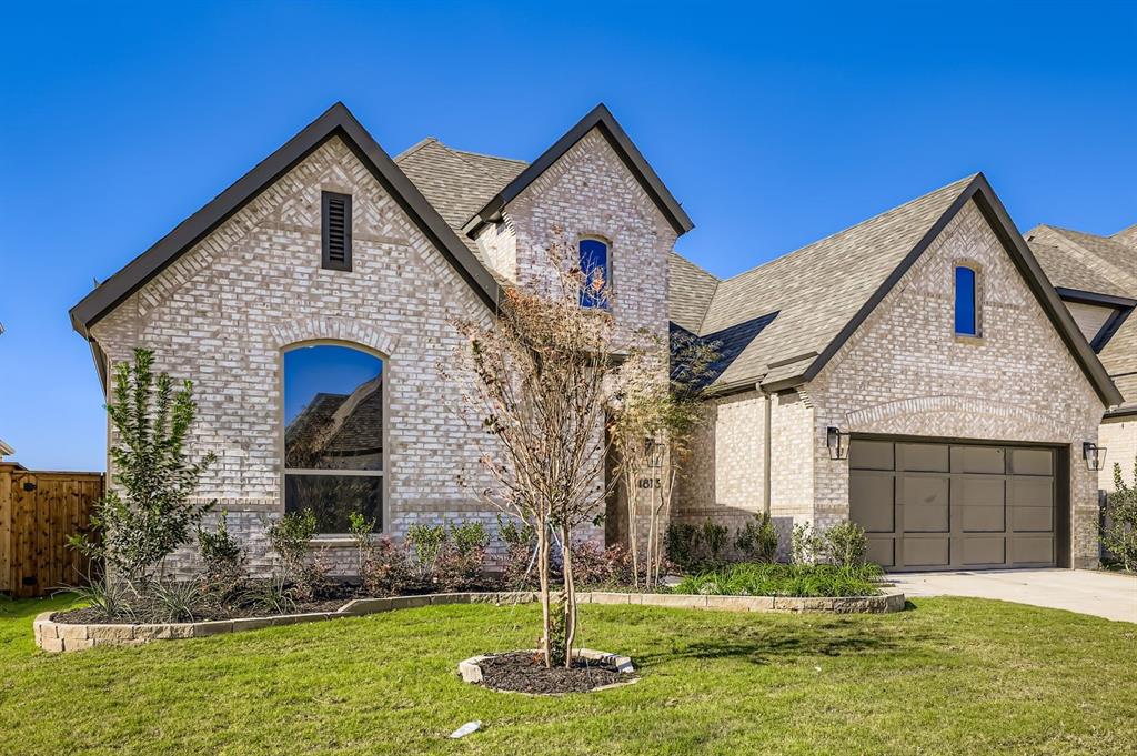 4813 Strada Street Prosper, TX 75078 - Photo 2 of 28 a front view of a house with a yard