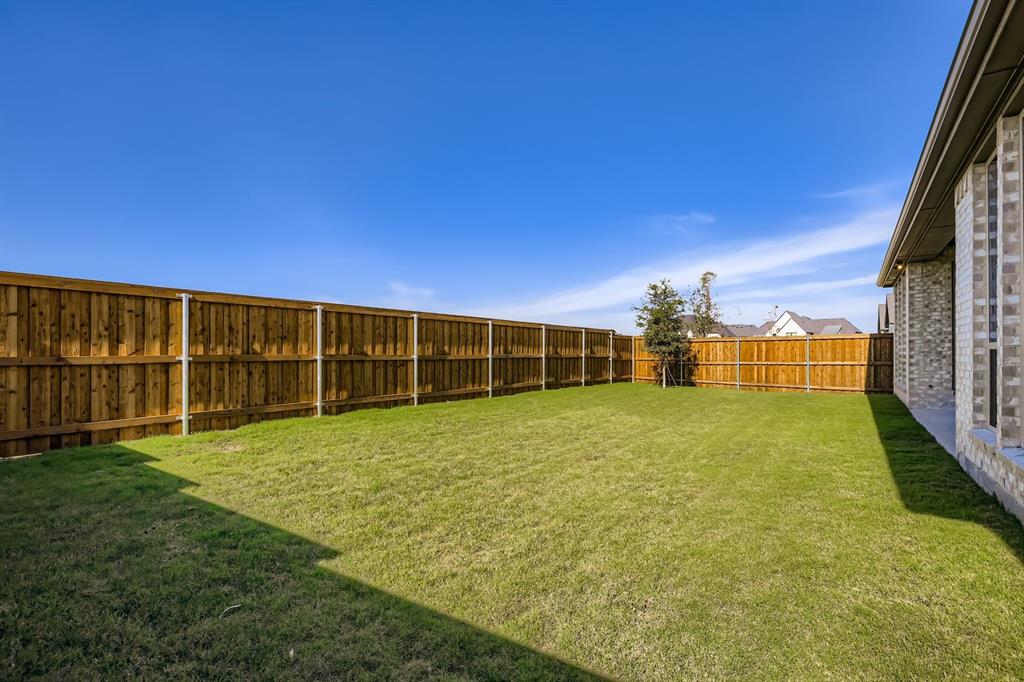 4813 Strada Street Prosper, TX 75078 - Photo 25 of 28 a view of an outdoor space and yard