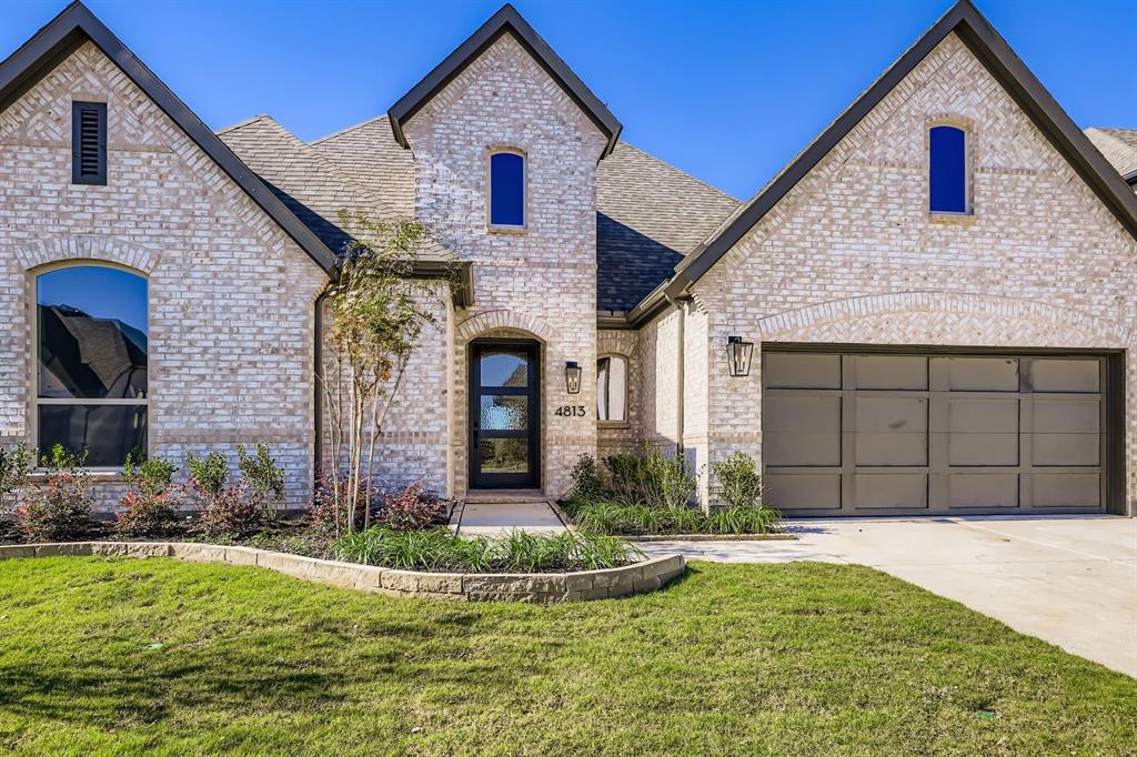 4813 Strada Street Prosper, TX 75078 - Photo 3 of 28 a front view of a house with garden