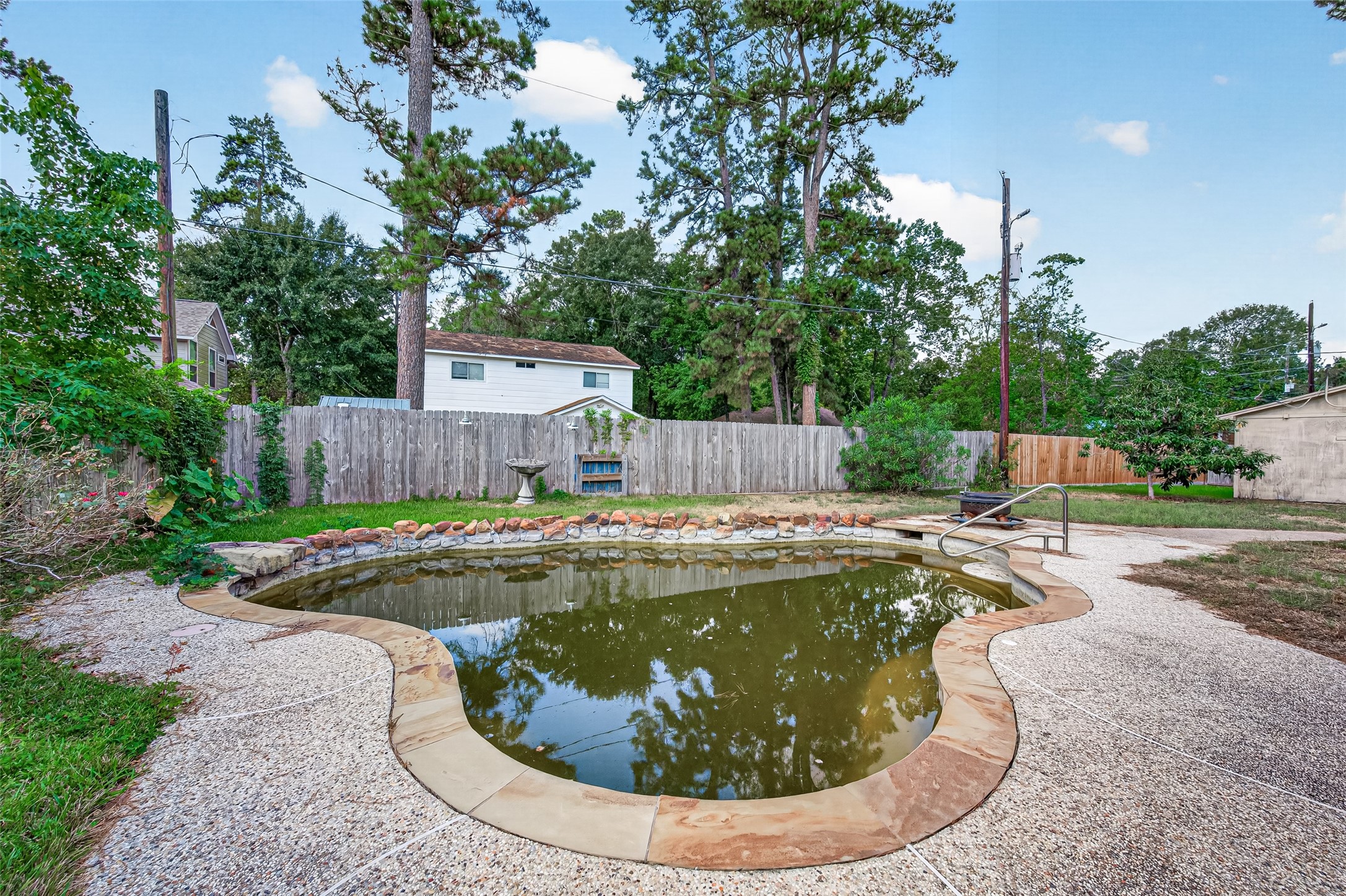 10211 Kerr Lane Conroe, TX 77385 - Photo 43 of 45 Pool with privacy fence