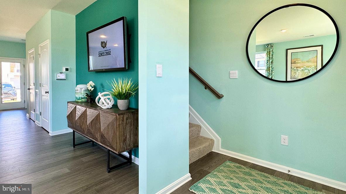 822 Mersey Lane Salisbury, MD 21801 - Photo 16 of 28 a view of a livingroom with furniture and wooden floor