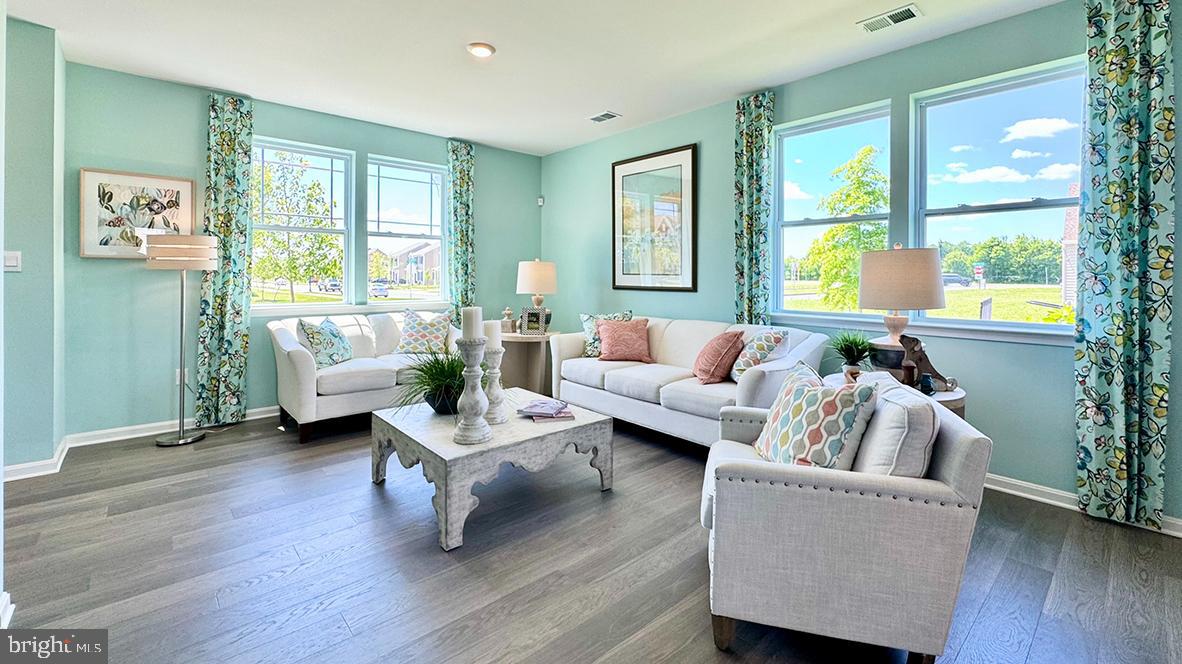 822 Mersey Lane Salisbury, MD 21801 - Photo 4 of 28 a living room with furniture and a large window