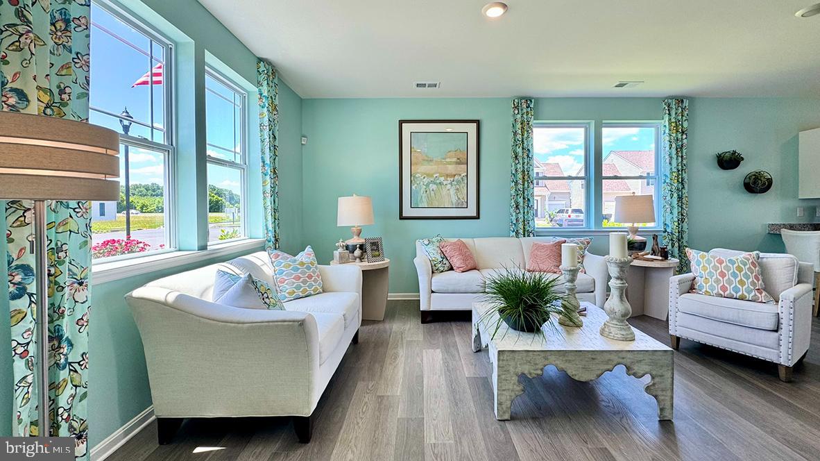 822 Mersey Lane Salisbury, MD 21801 - Photo 5 of 28 a living room with furniture and a large window