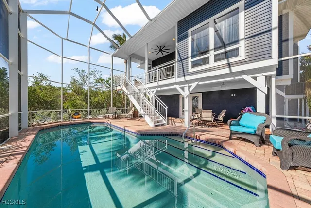 a view of a swimming pool with a patio