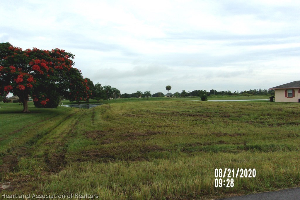 6609 Concord Street Sebring, FL 33876 - Photo 14 of 14 a view of a lake with a big yard
