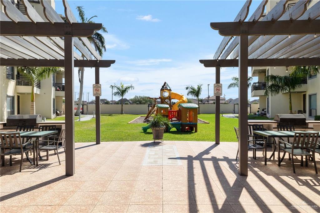 813 Travis Street, Unit 314 Mission, TX 78572 - Photo 20 of 26 a view of a house with backyard porch and sitting area