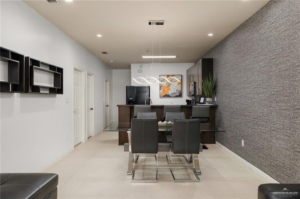 813 Travis Street, Unit 314 Mission, TX 78572 - Photo 6 of 26 a view of a dining room with furniture