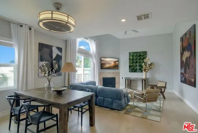 a view of a livingroom with furniture and a fireplace