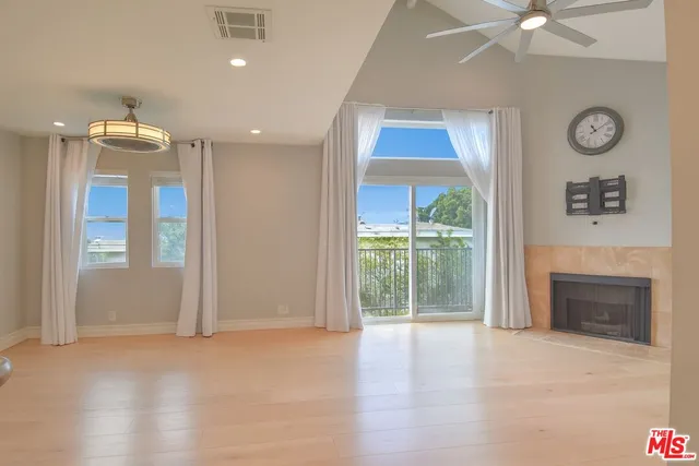 a kitchen with a sink and a fireplace