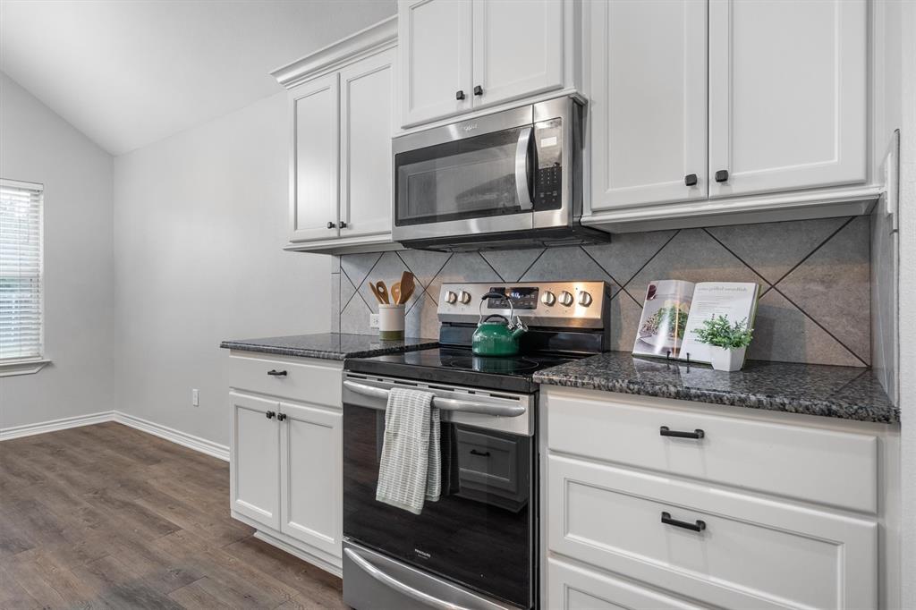 151 Birdsong Lane Terrell, TX 75160 - Photo 14 of 28 Modern stainless steel appliances, sleek cabinetry, and durable surfaces.