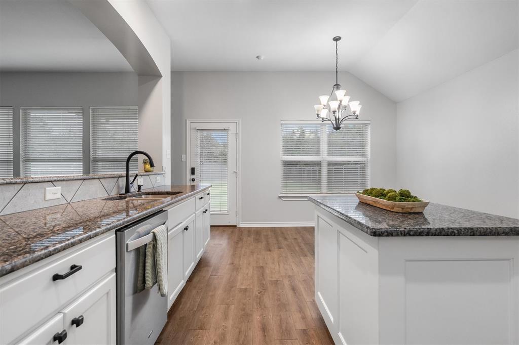 151 Birdsong Lane Terrell, TX 75160 - Photo 15 of 28 Spacious layout with island seating and clear sightlines to the living area, perfect for entertaining.