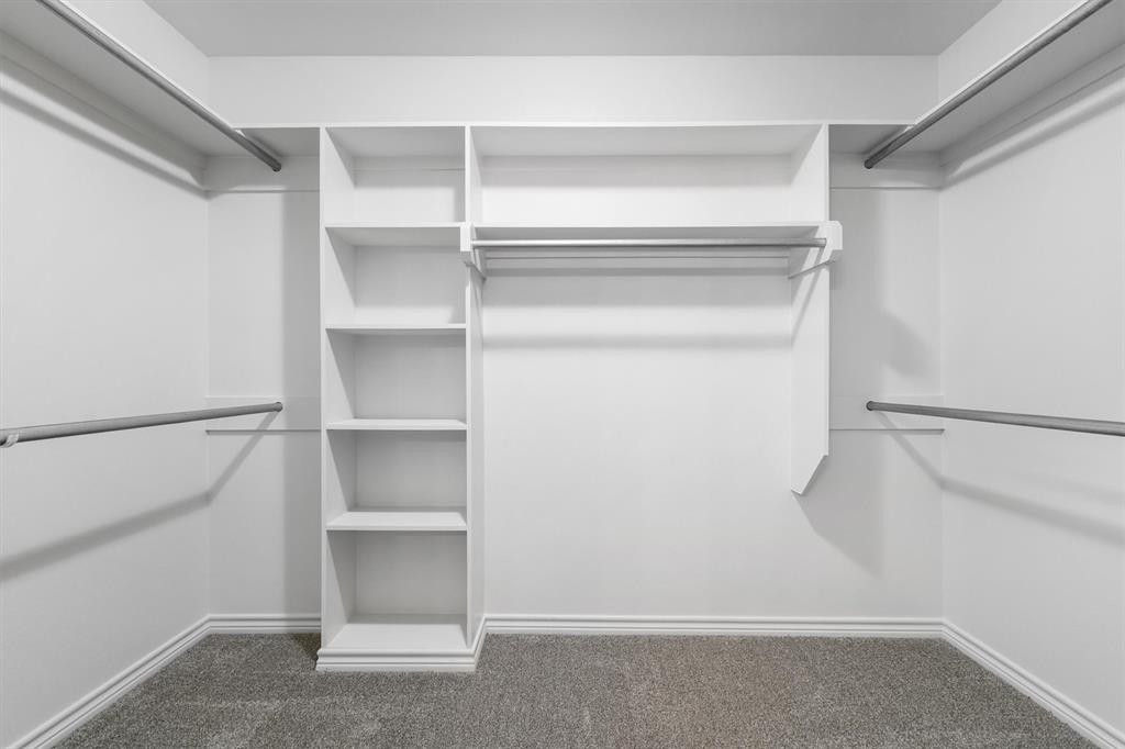 151 Birdsong Lane Terrell, TX 75160 - Photo 19 of 28 Large walk-in closet with built-in shelving and ample storage space for organization.