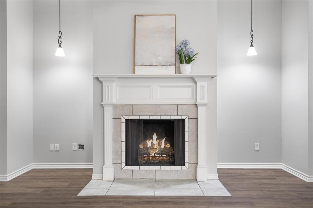 151 Birdsong Lane Terrell, TX 75160 - Photo 8 of 28 Beautiful fireplace with classic mantel design, creating a warm and inviting centerpiece for the living space.