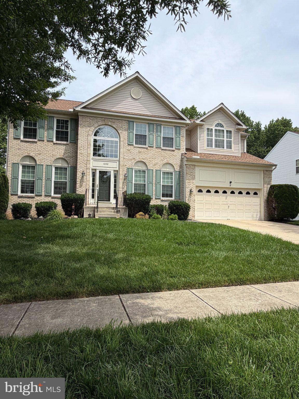 1202 Strausberg Street Accokeek, MD 20607 - Photo 41 of 43 Charming brick home with lush greenery.