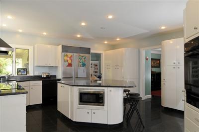 590 New Bedford Road Rochester, MA 02770 - Photo 10 of 20 a kitchen with stainless steel appliances kitchen island granite countertop a stove a sink and a refrigerator