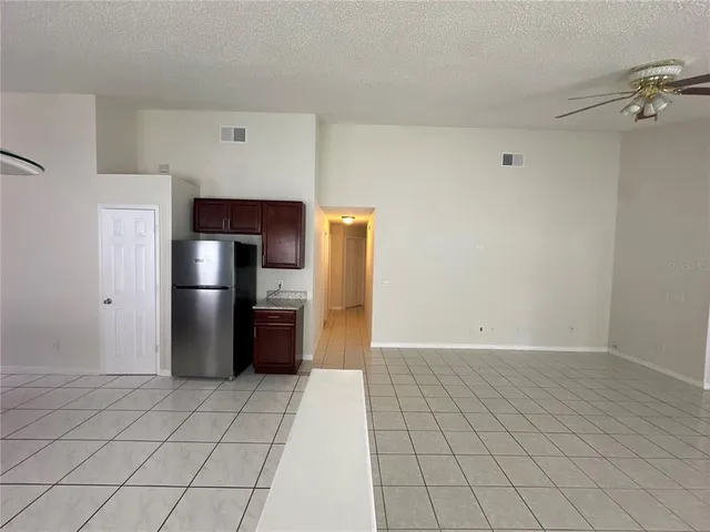 a kitchen with stainless steel appliances a stove a refrigerator sink and microwave