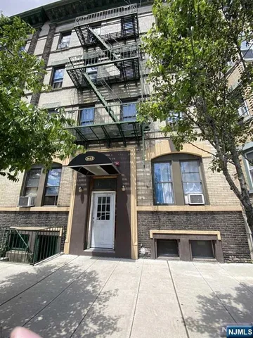 a building with a tree in front of it