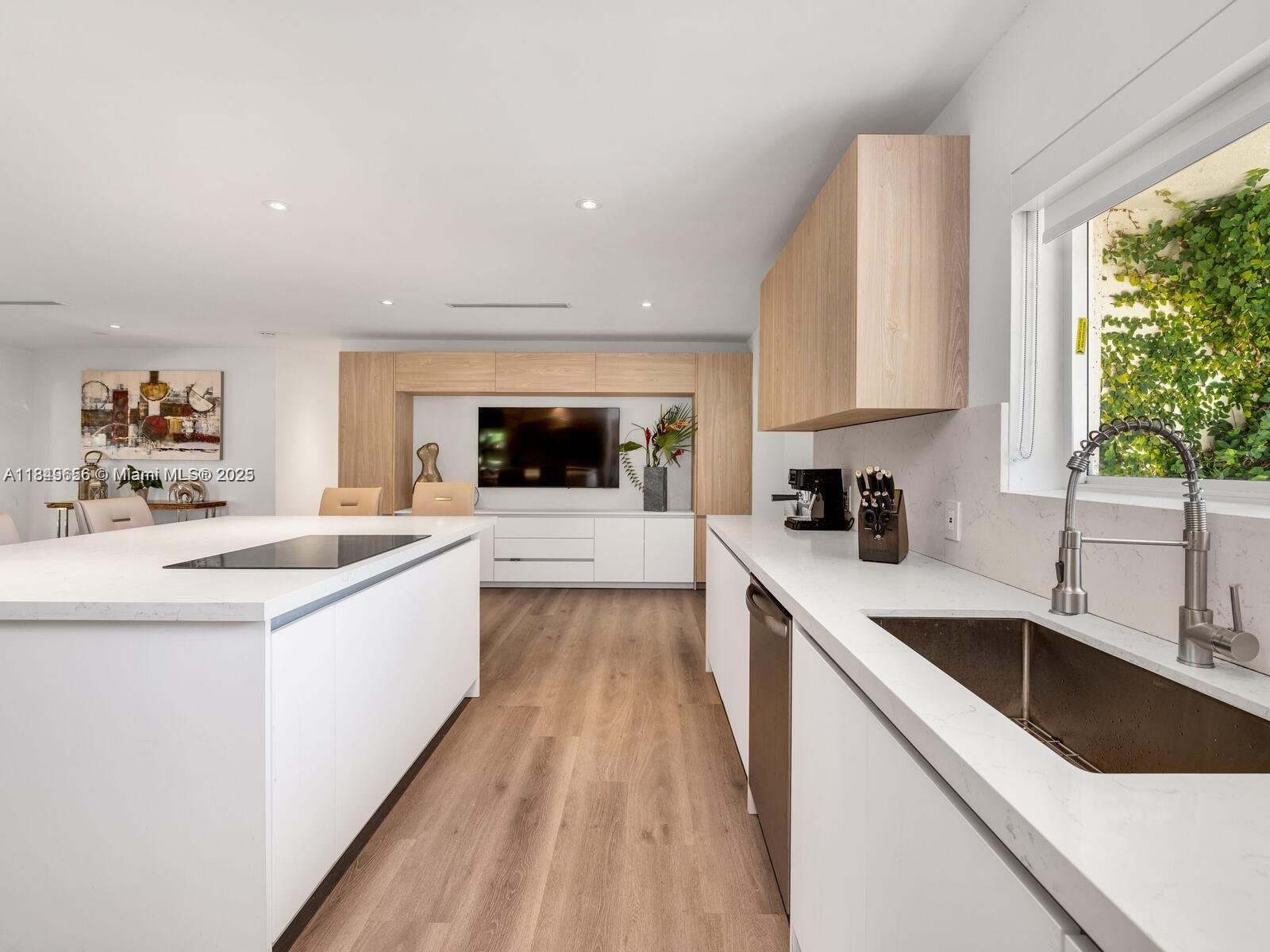 13350 Luray Road Southwest Ranches, FL 33330 - Photo 11 of 56 a large kitchen with a sink and cabinets