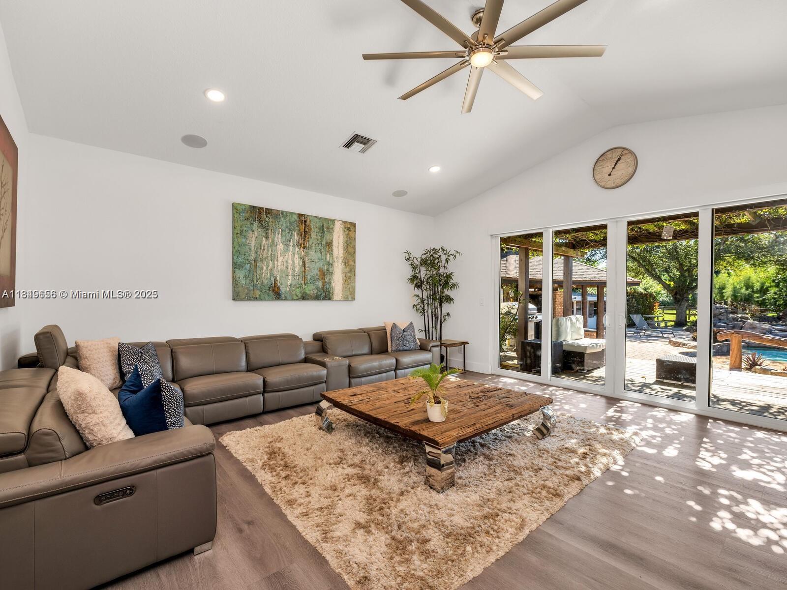 13350 Luray Road Southwest Ranches, FL 33330 - Photo 14 of 56 a living room with furniture and a large window