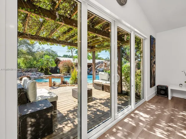 a bedroom with a bed and a view of kitchen