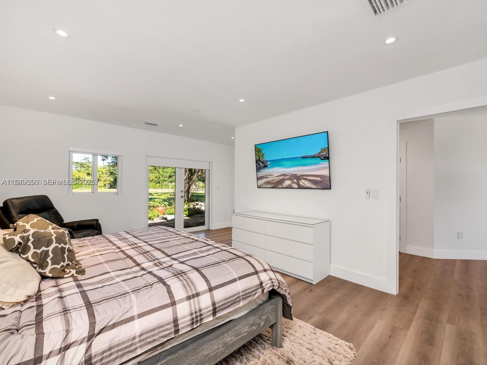 13350 Luray Road Southwest Ranches, FL 33330 - Photo 20 of 56 a bedroom with a bed and a dresser