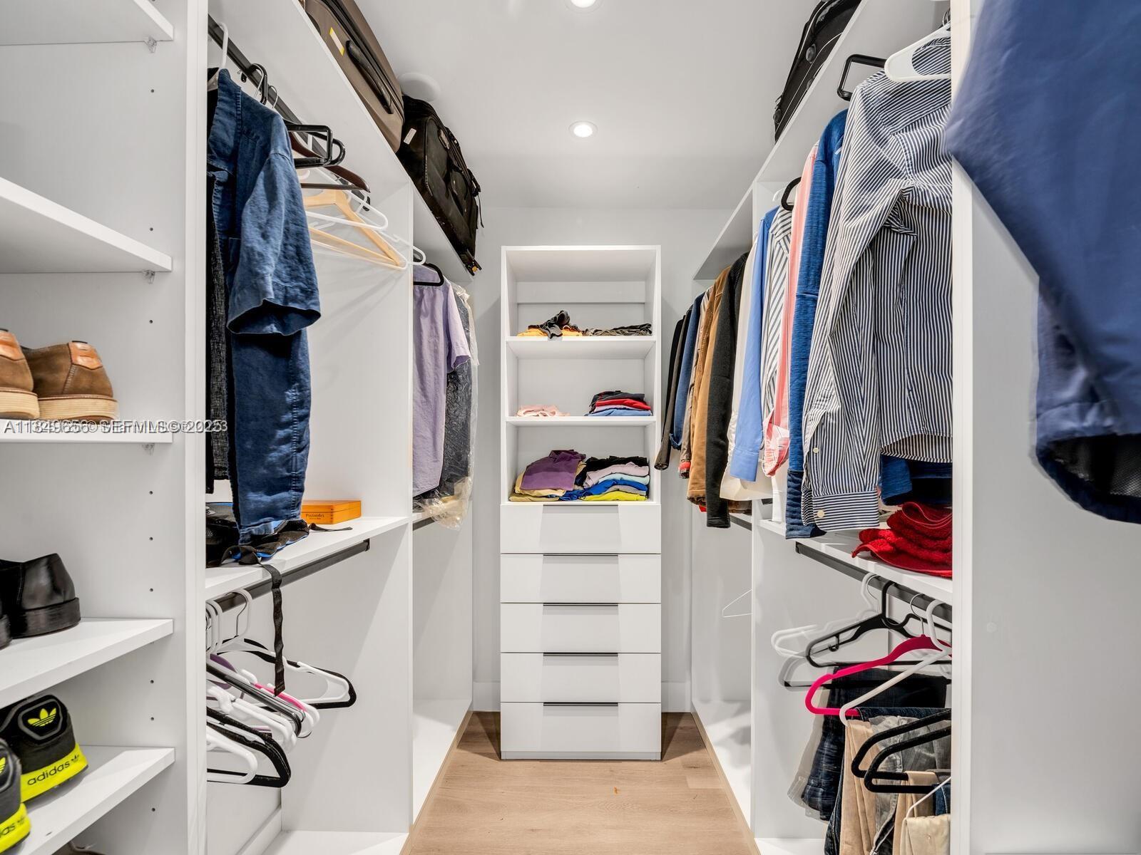 13350 Luray Road Southwest Ranches, FL 33330 - Photo 21 of 56 a view of walk in closet with clothes and shoes