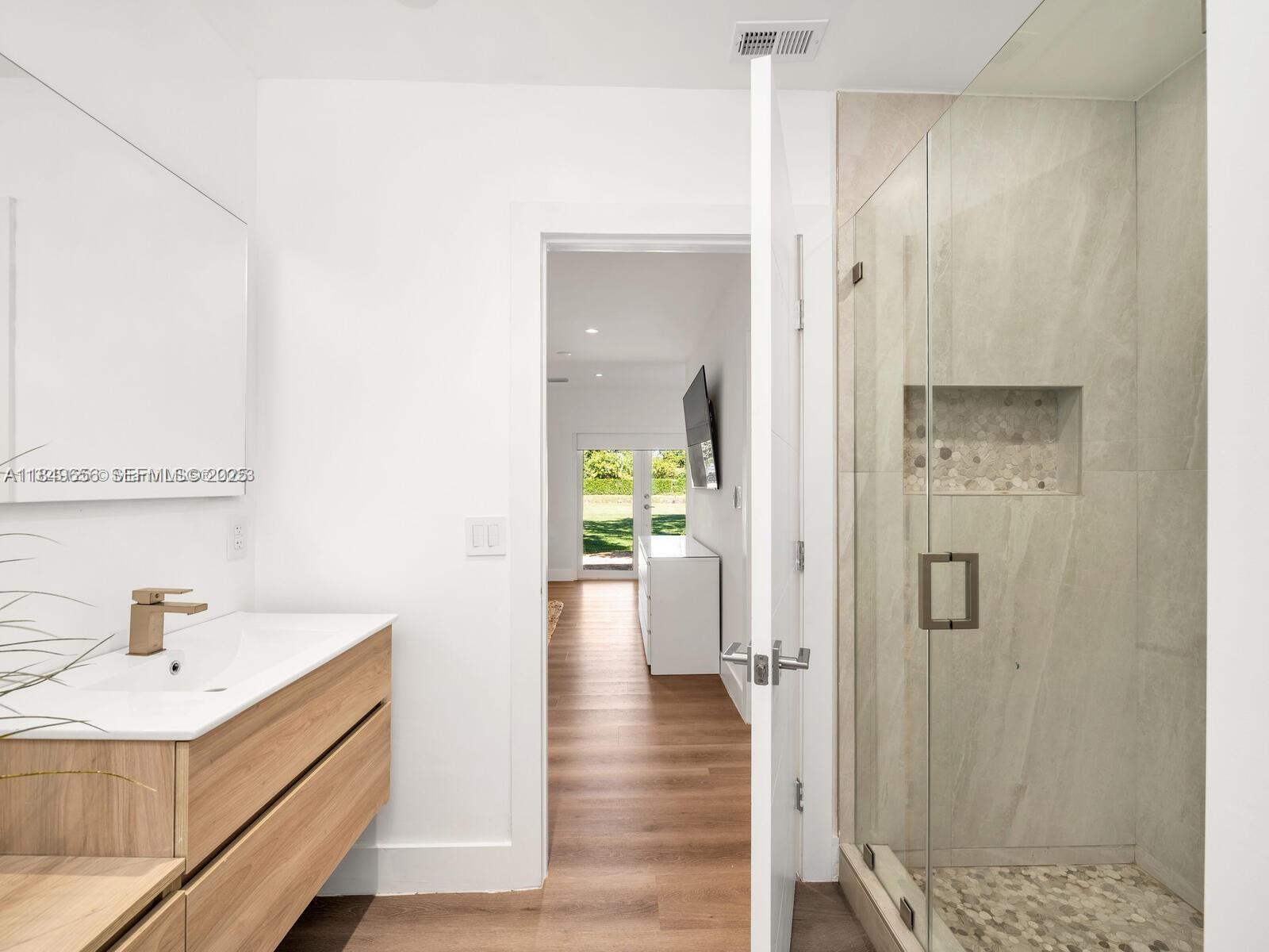 13350 Luray Road Southwest Ranches, FL 33330 - Photo 22 of 56 a bathroom with a sink and shower