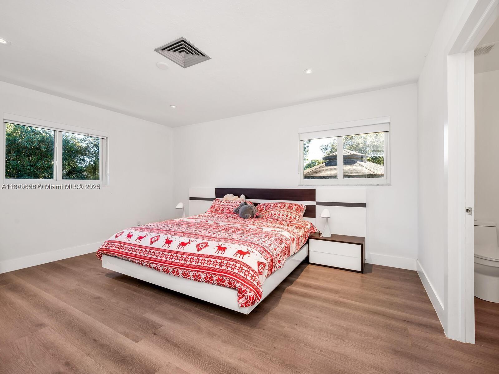 13350 Luray Road Southwest Ranches, FL 33330 - Photo 26 of 56 a bedroom with a bed and a window