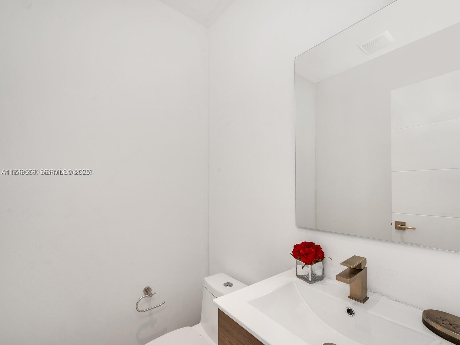 13350 Luray Road Southwest Ranches, FL 33330 - Photo 28 of 56 a bathroom with a sink and a toilet