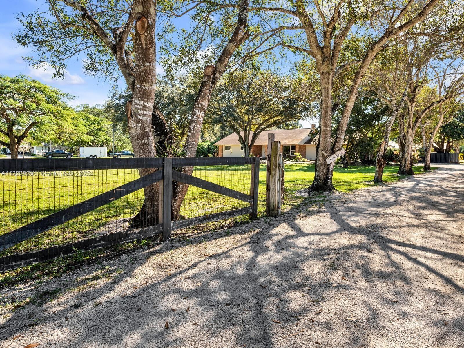 13350 Luray Road Southwest Ranches, FL 33330 - Photo 3 of 56 a view of a backyard with swimming pool