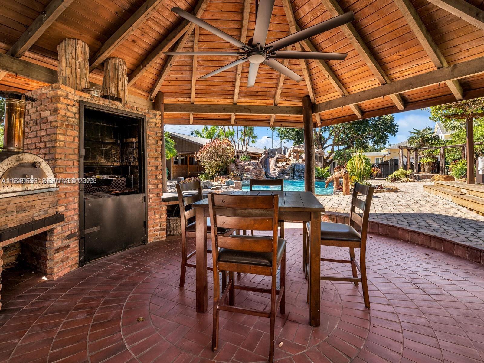 13350 Luray Road Southwest Ranches, FL 33330 - Photo 34 of 56 a view of a chairs and tables in the patio