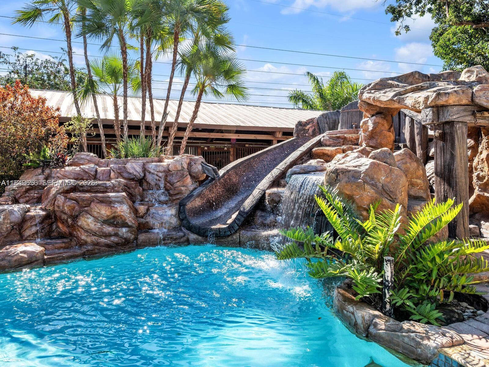 13350 Luray Road Southwest Ranches, FL 33330 - Photo 38 of 56 a view of backyard with swimming pool and outdoor seating