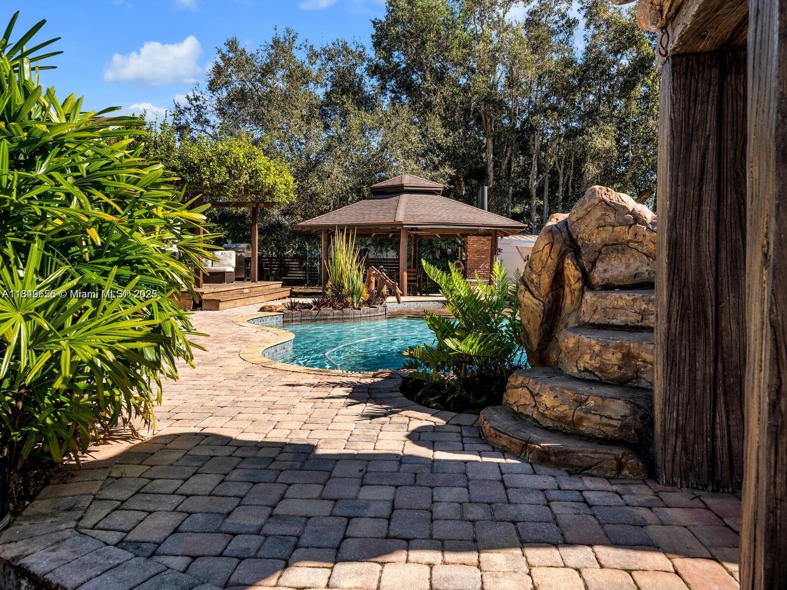 13350 Luray Road Southwest Ranches, FL 33330 - Photo 40 of 56 a view of a pathway with a patio