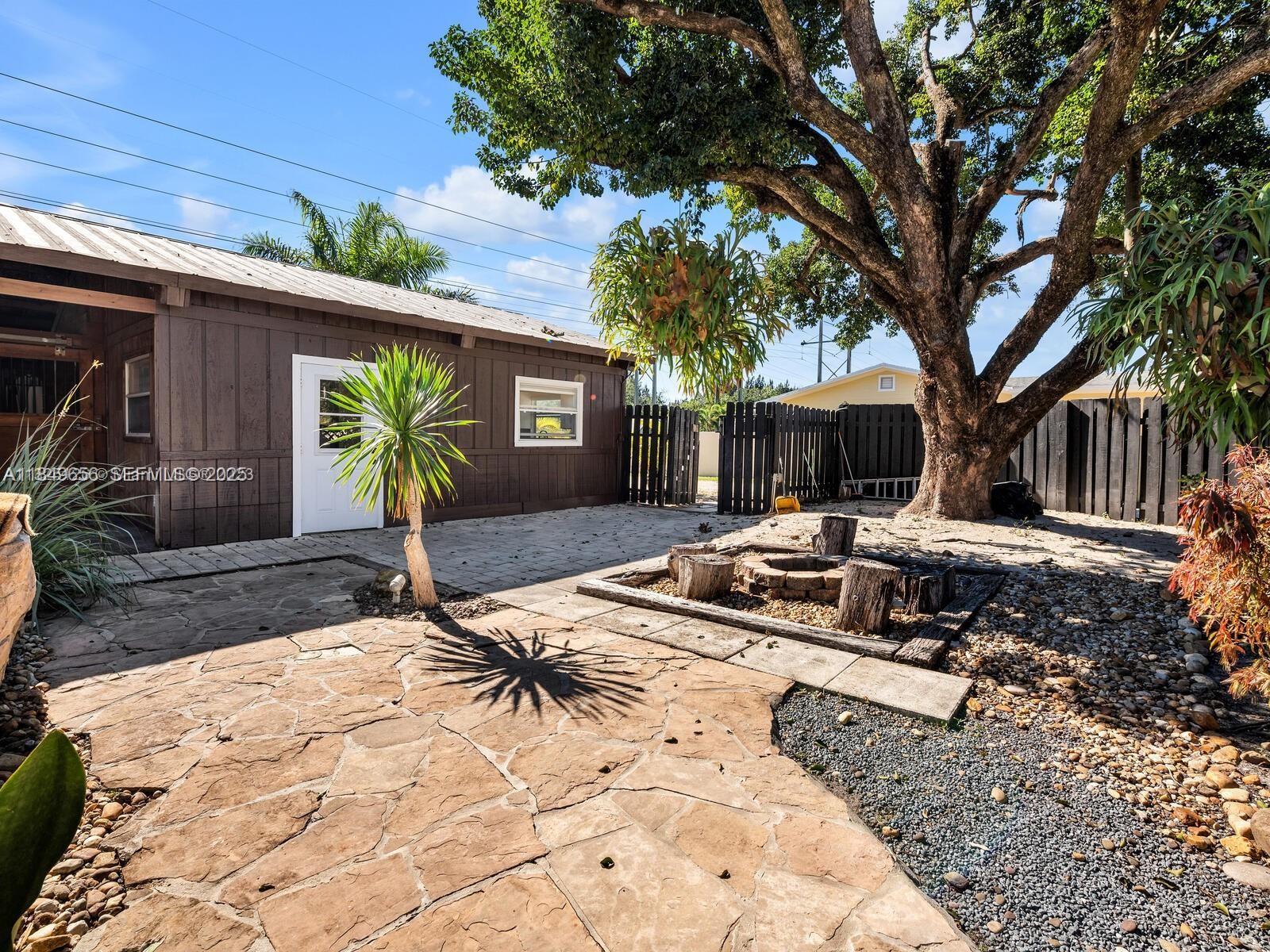 13350 Luray Road Southwest Ranches, FL 33330 - Photo 41 of 56 a view of a backyard with a patio