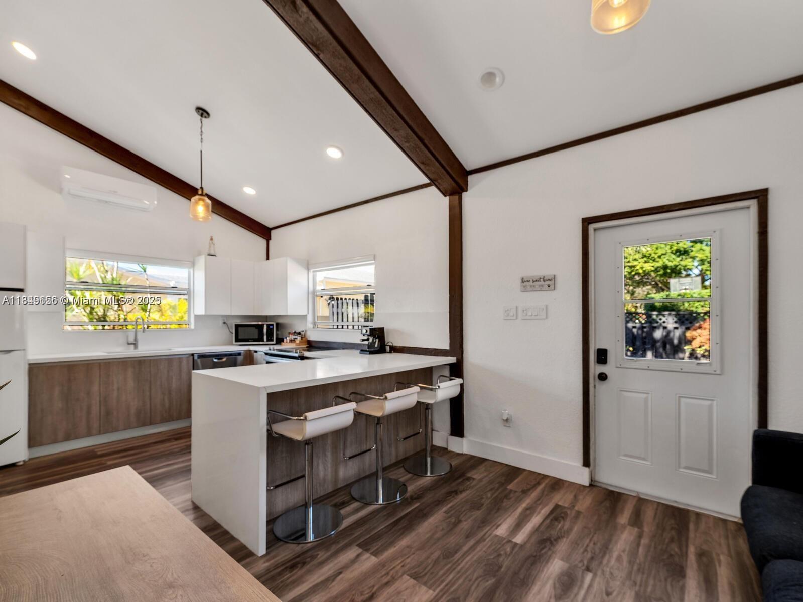 13350 Luray Road Southwest Ranches, FL 33330 - Photo 42 of 56 a kitchen with stainless steel appliances granite countertop a stove a sink and a refrigerator