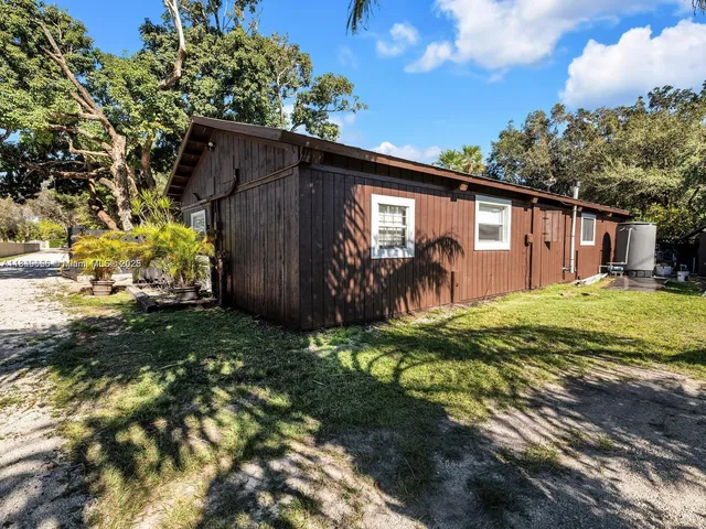 an aerial view of a house with a garden
