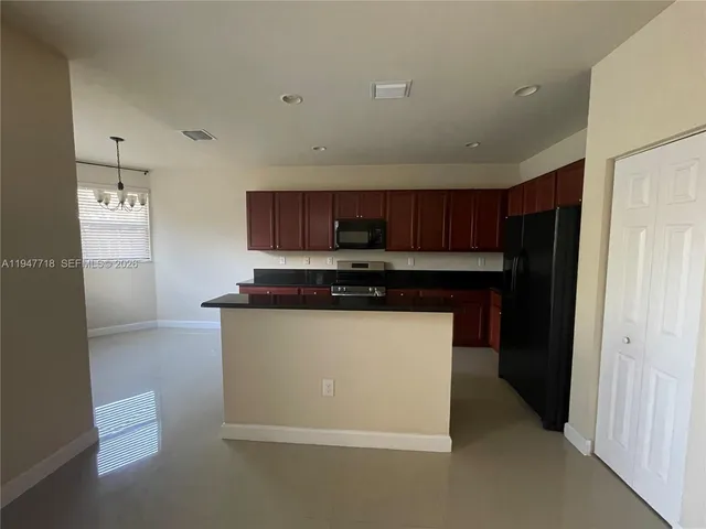 an empty room with a empty space and a window