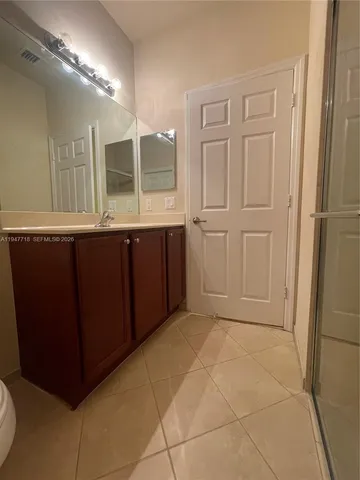 a bathroom with a sink and mirror