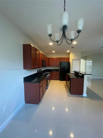 a kitchen with granite countertop lots of counter top space