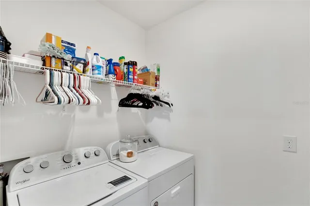 a kitchen with stainless steel appliances kitchen island granite countertop a kitchen island a stove a table and chairs