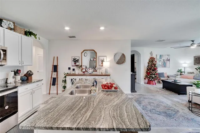 a living room with furniture a rug and a window