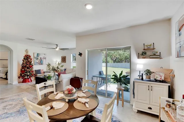 a bedroom with a bed and a couch with window