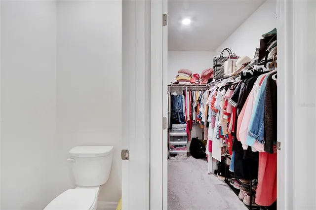 an aerial view of a house with a garden and lake view