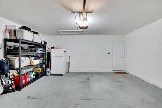 an aerial view of residential houses with outdoor space and swimming pool
